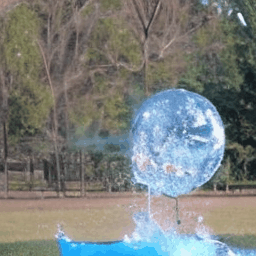 Balloon full of water exploding in extreme slow motion.